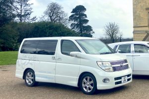 wedding minibus outside stately home